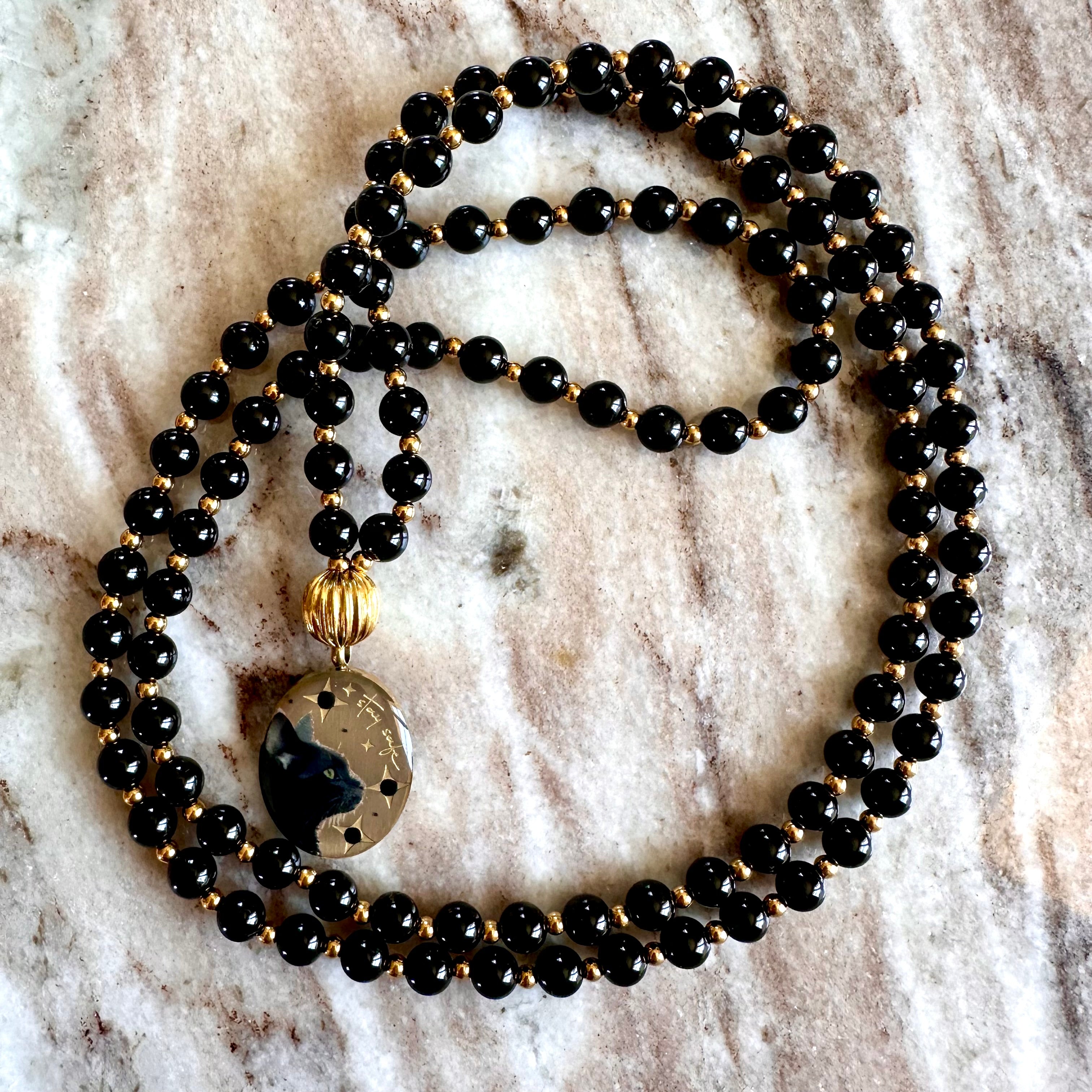 Réservation Mala précieux Protection: Le chat et Onyx noir