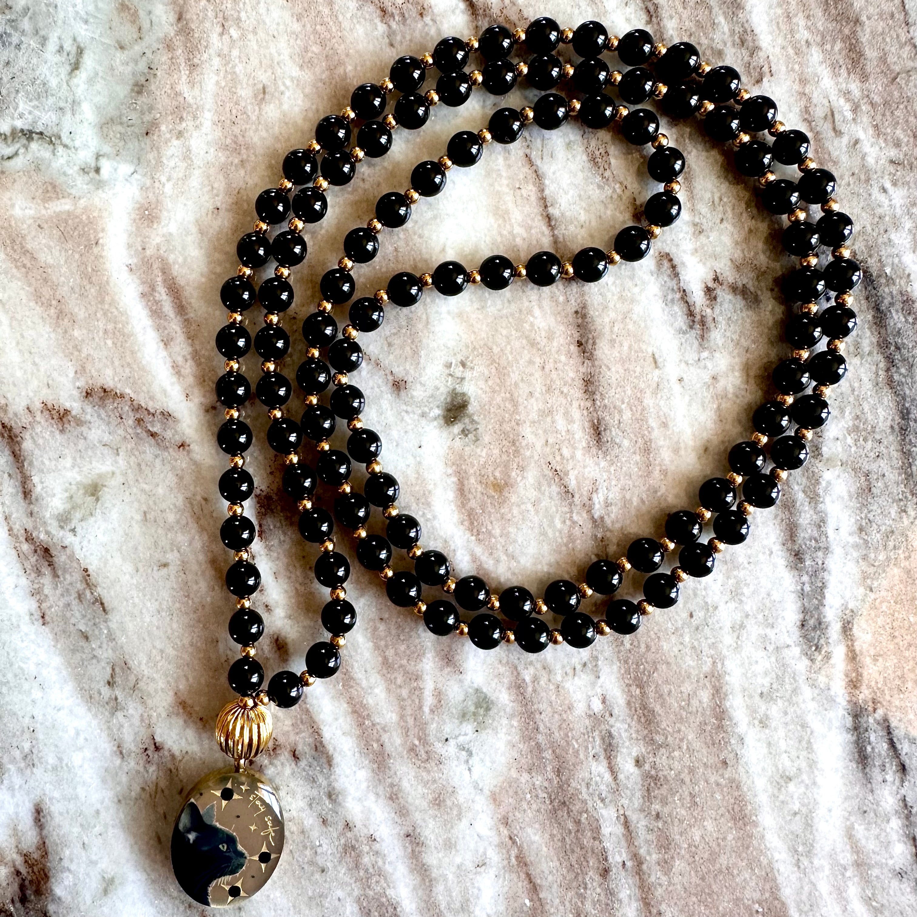 Réservation Mala précieux Protection: Le chat et Onyx noir